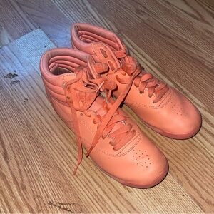pinkish, orangish reebok